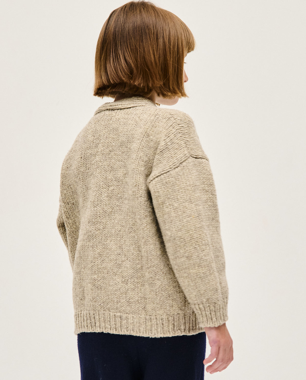 Kids' Babaà No17 Mist cardigan in soft knit, featuring a cozy, stylish design with button closure and ribbed cuffs.