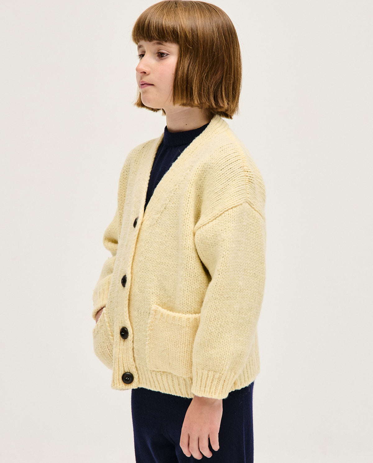 Children's natural beige cardigan by Babaà, soft knit with button closure, suitable for kids' casual wear.