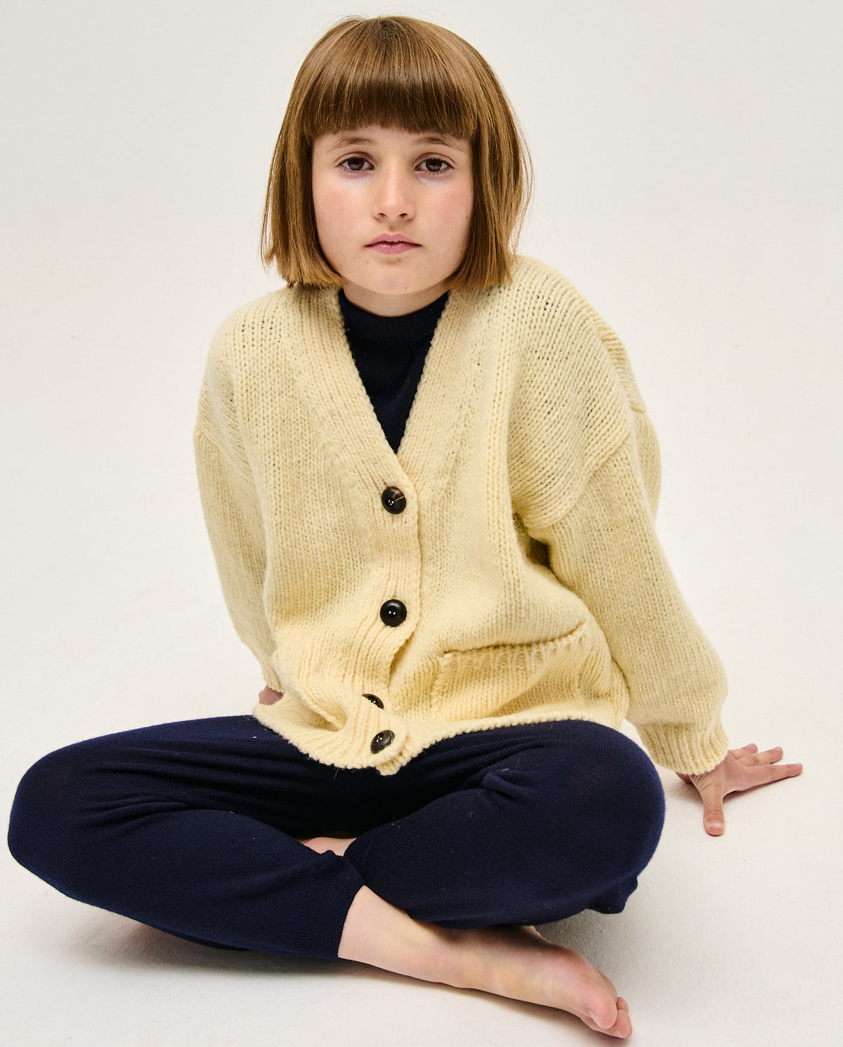 Kids' natural beige cardigan by Babaà, soft knit with button closure, perfect for casual or dressy outfits.