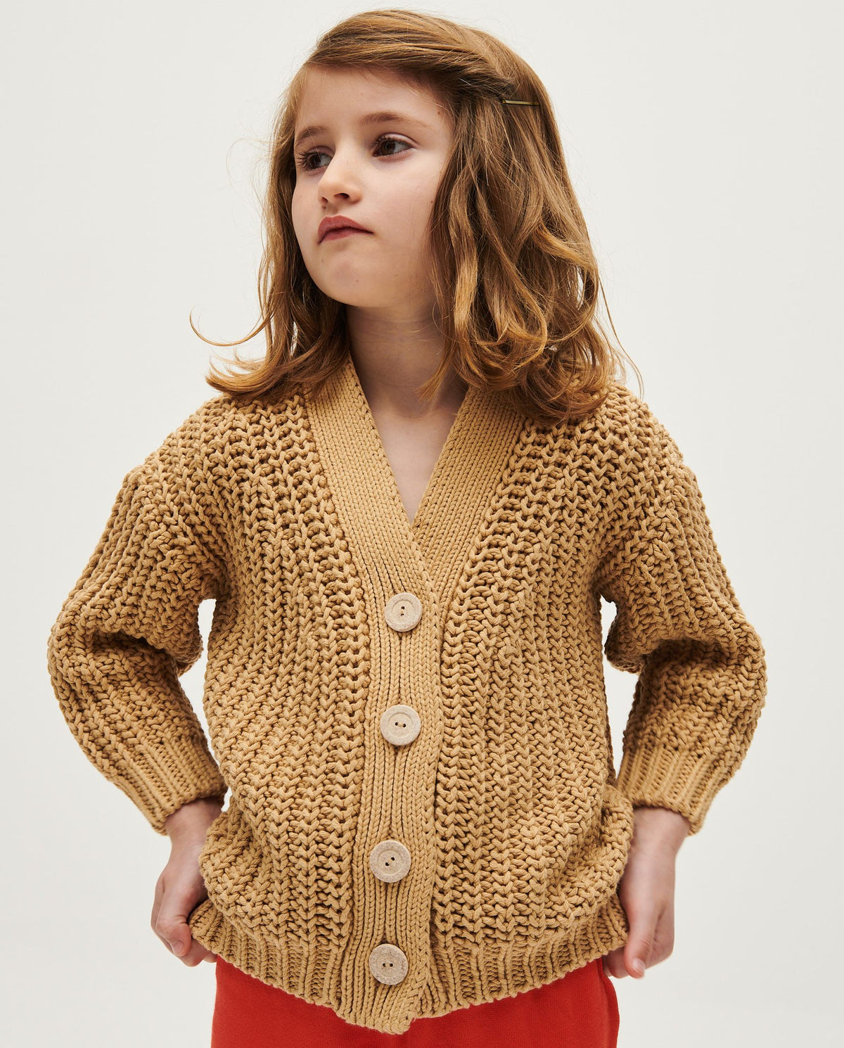 Kids' cardigan by Babaà in clay pot color, featuring a cozy knit design with buttons, perfect for children.