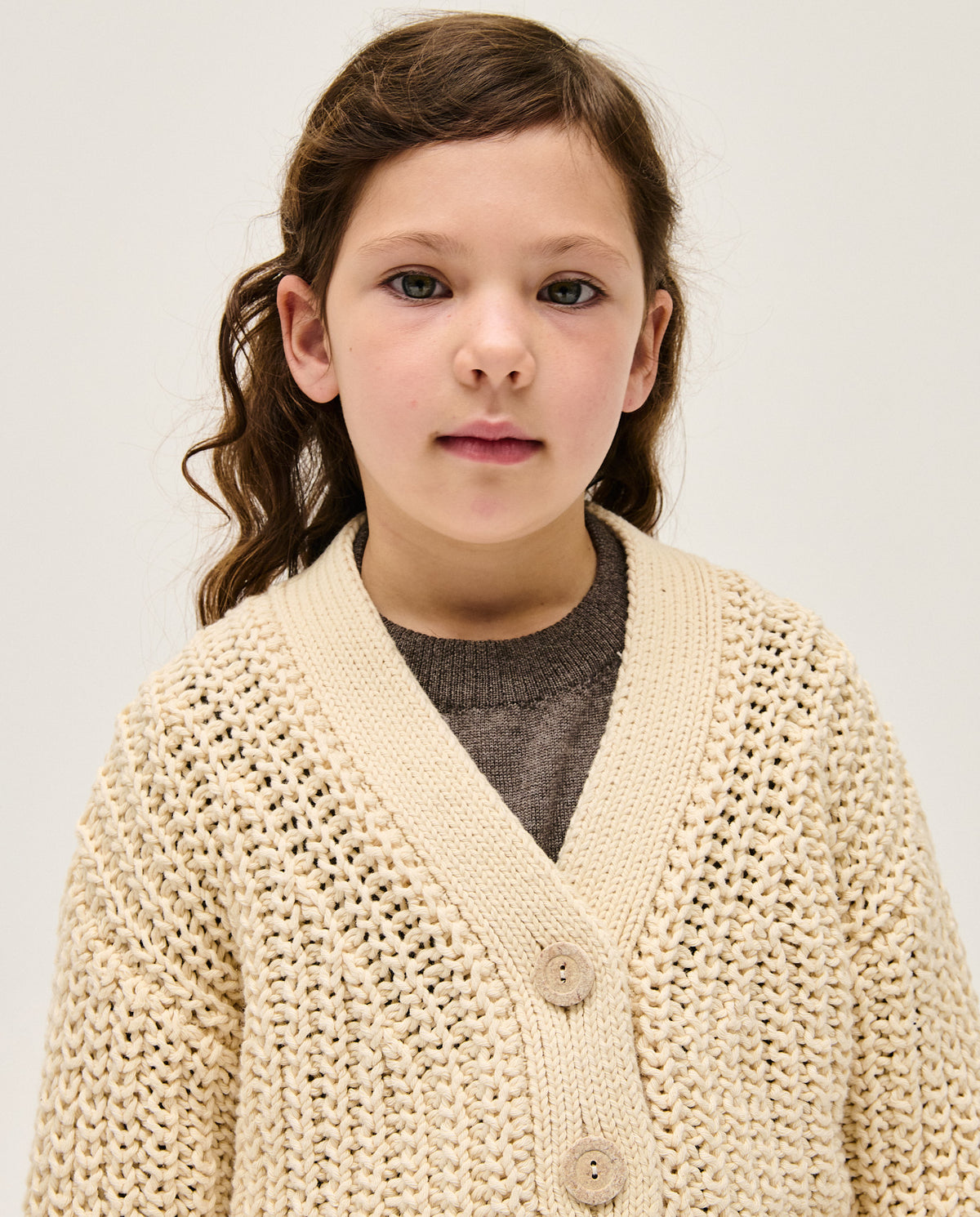 Baby girl's Babaà No18 natural cardigan with long sleeves and button-front, soft knit for cozy comfort.