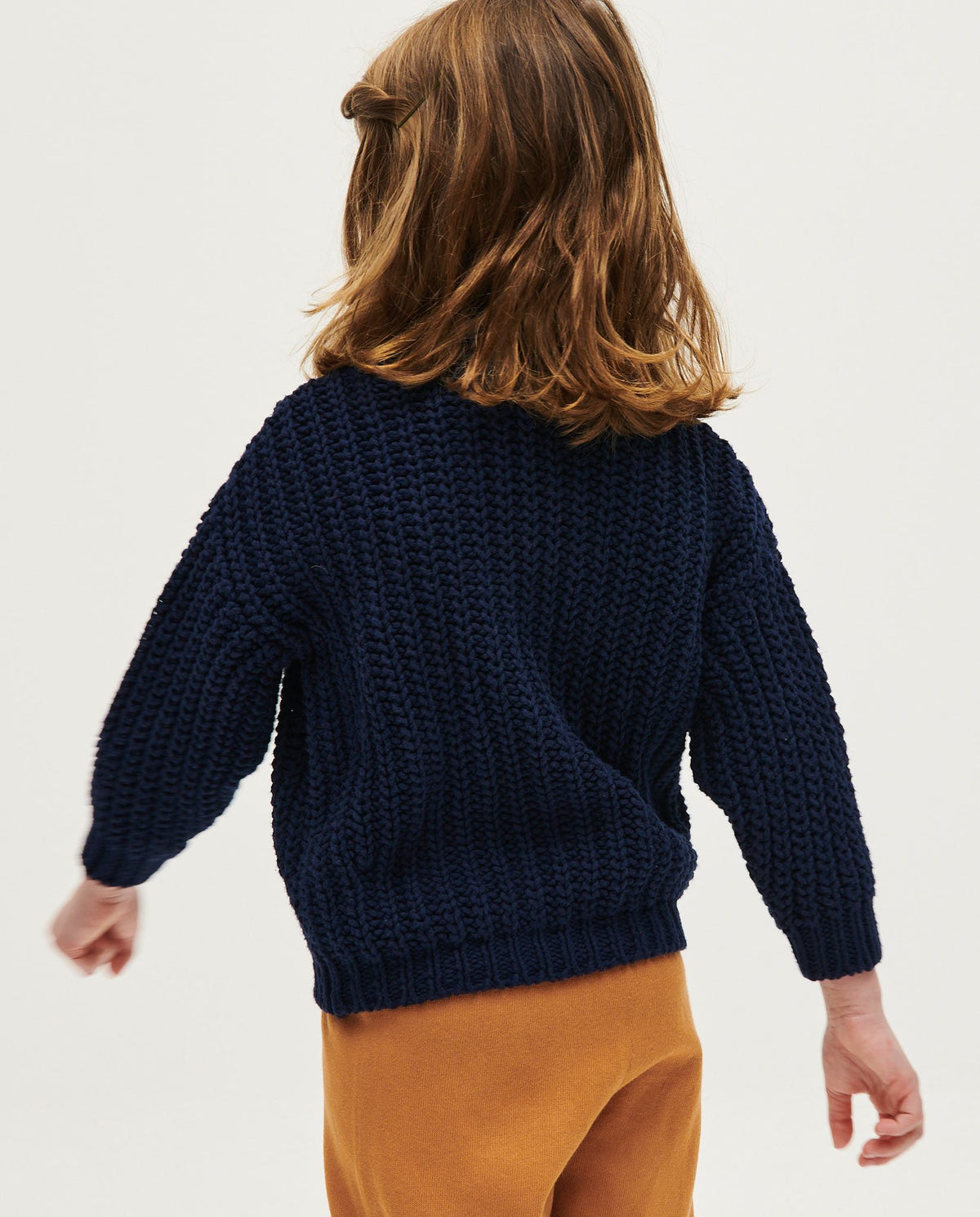 Navy children's cardigan by Babaà featuring a soft knit fabric and button closure, perfect for casual or dressy wear.