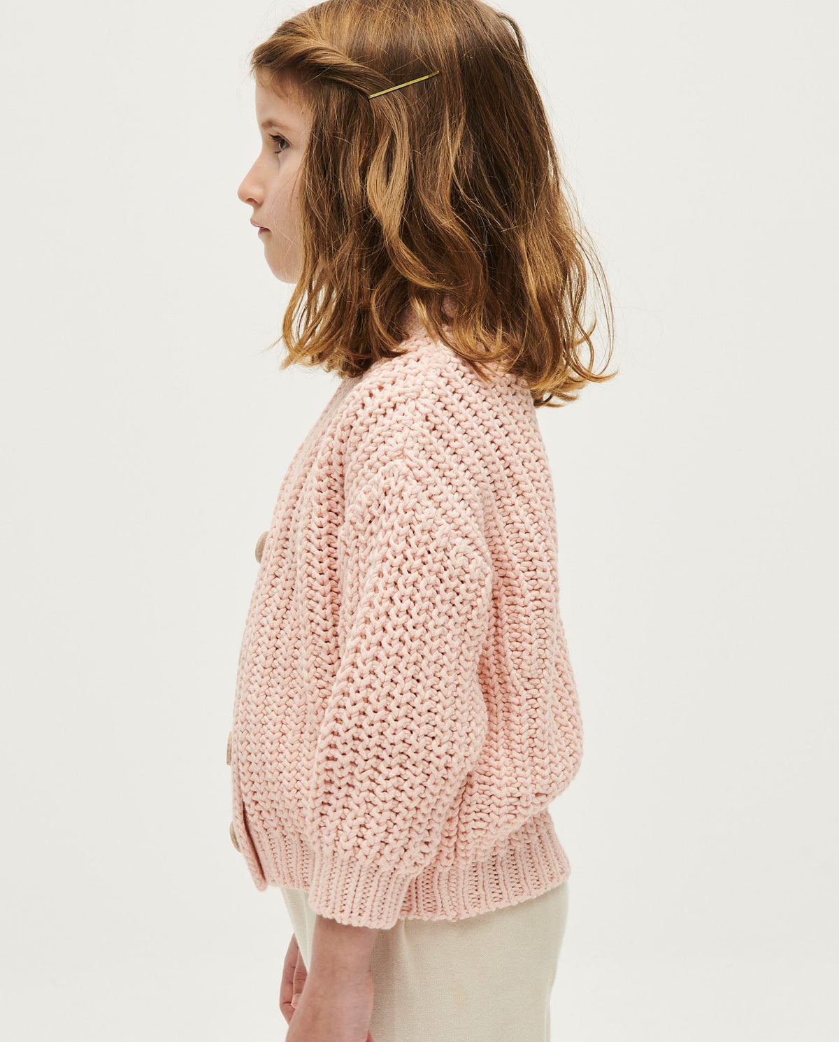 Babaà kids' No18 petal plum cardigan, soft knit fabric, long sleeves, and button closure, displayed on a hanger.