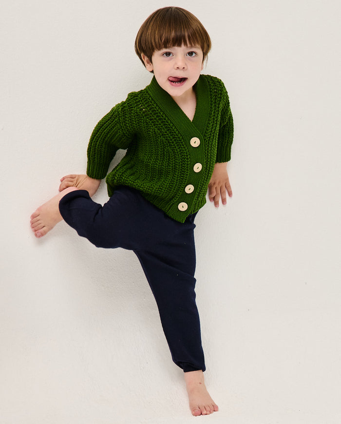 Kids' Babaà No18 pine cardigan with a cozy knit design, featuring a soft, natural pine green color and button closure.