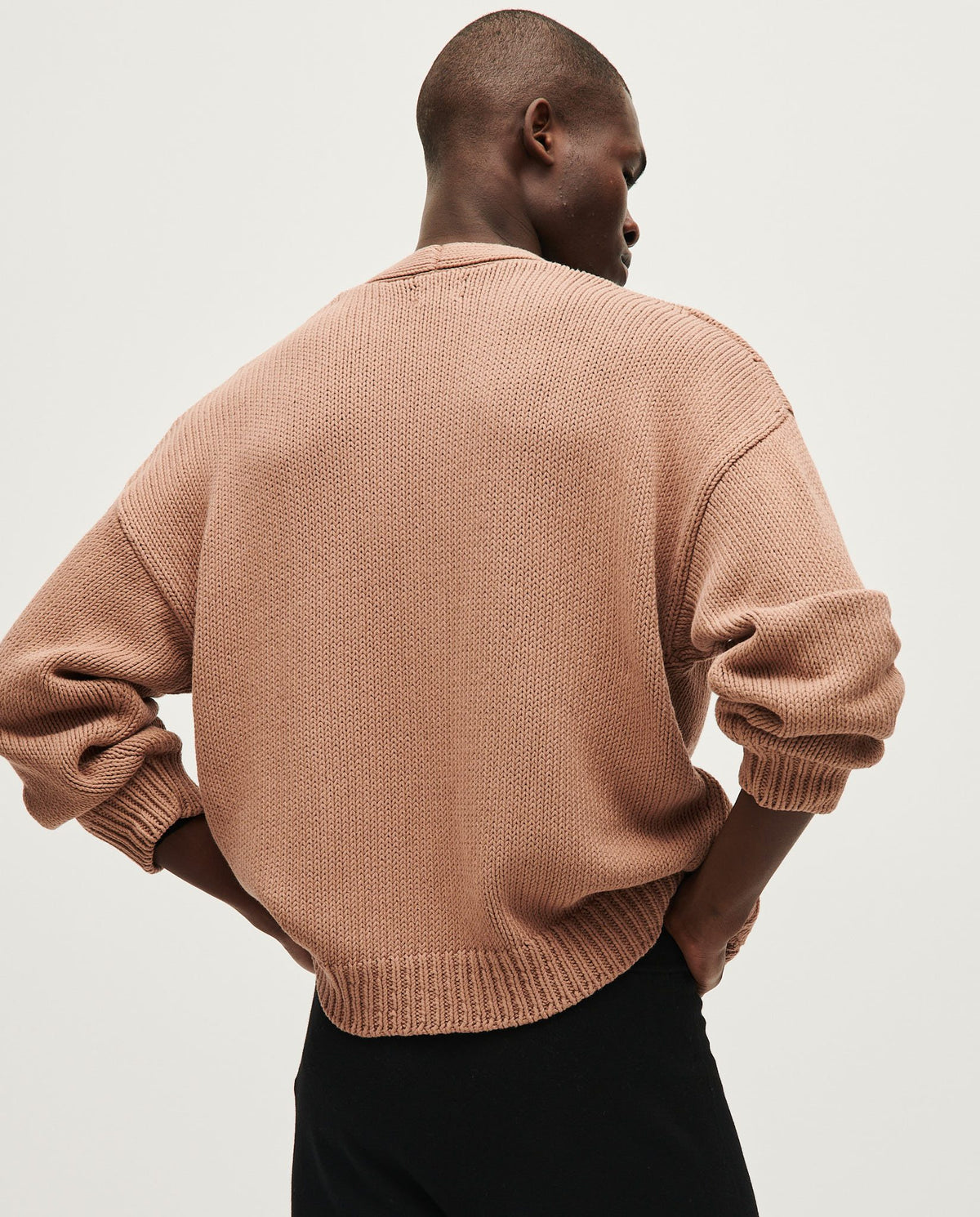 Babaà men's No16 roasted fig cardigan displayed on a hanger, featuring a cozy knit fabric in a warm roasted fig color.