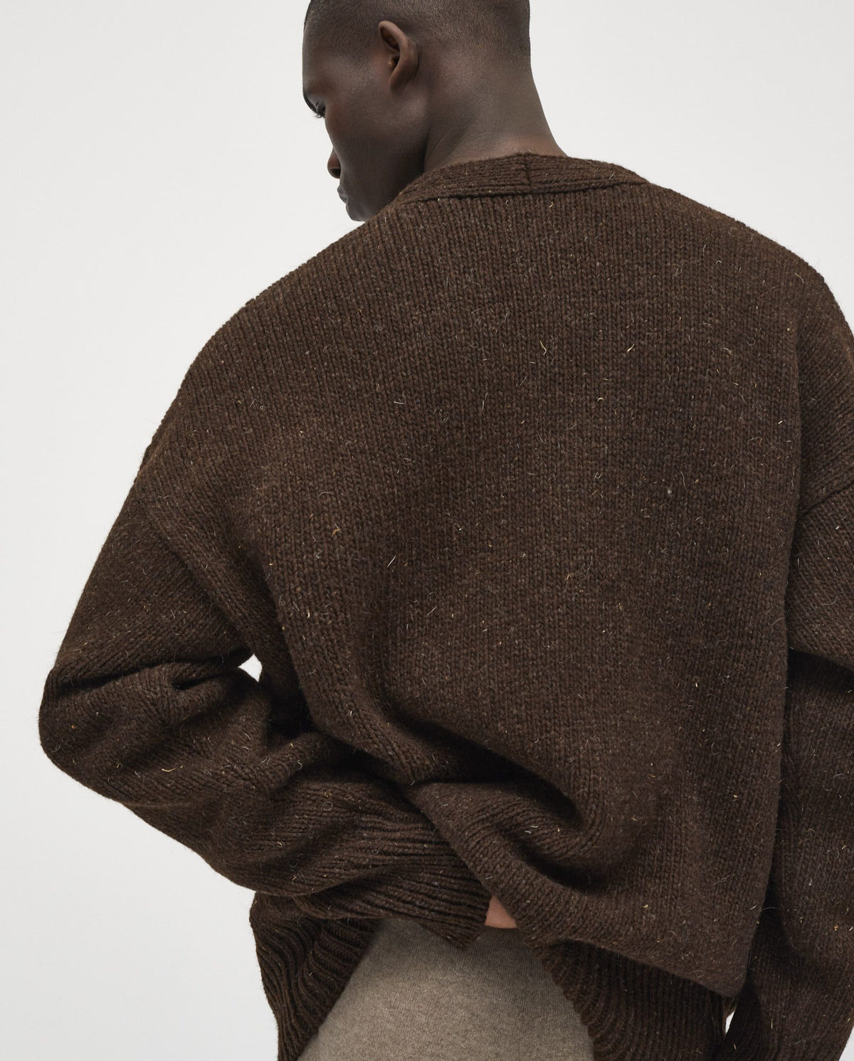 Babaà men's No17 Earth cardigan featuring a cozy knit texture, in earthy tones, with a button-up front and ribbed cuffs.