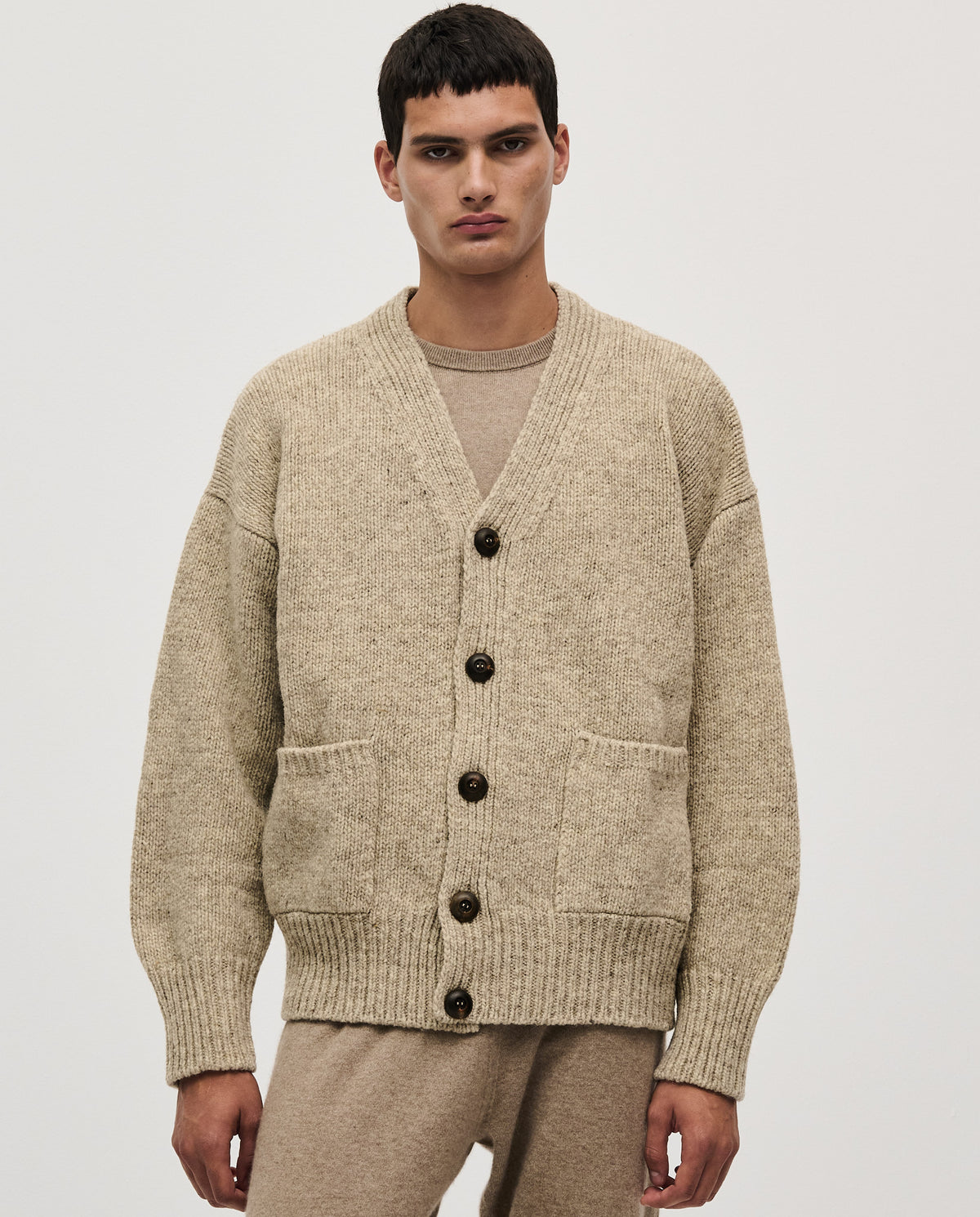 Babaà men's No17 Mist cardigan, soft knit fabric in a light mist color, featuring a button-up front and ribbed cuffs.