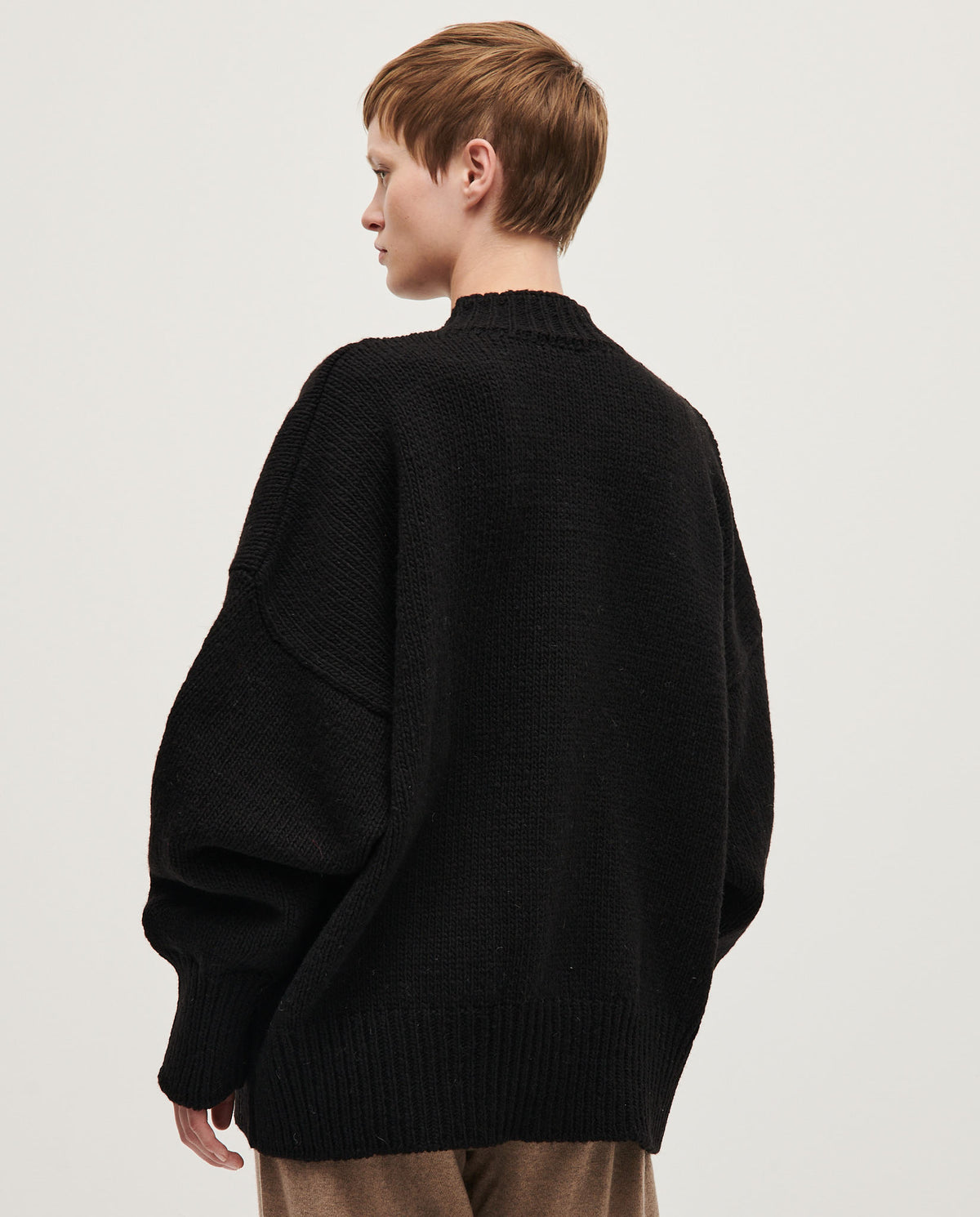 Black Babaà No11 women's cardigan with a soft knit texture, featuring a relaxed fit and button front for versatile styling.