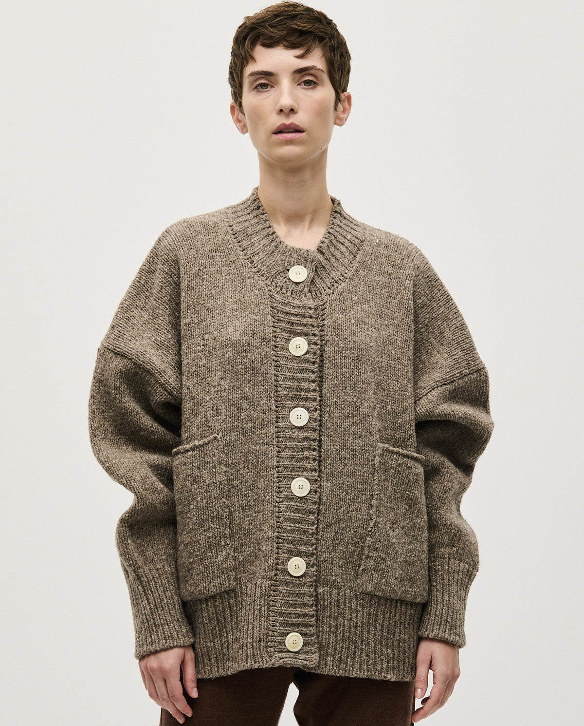 Babaà No11 dark mist women's cardigan displayed on a hanger, showcasing soft knit fabric and relaxed fit.