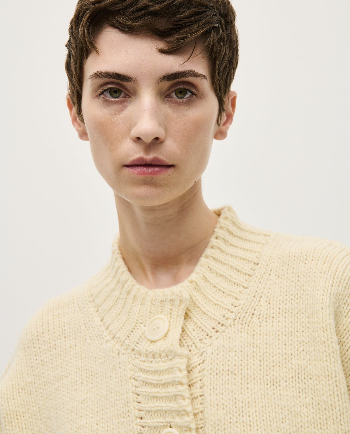 Babaà No11 natural women's cardigan, soft knit with long sleeves and open front, styled on a hanger.