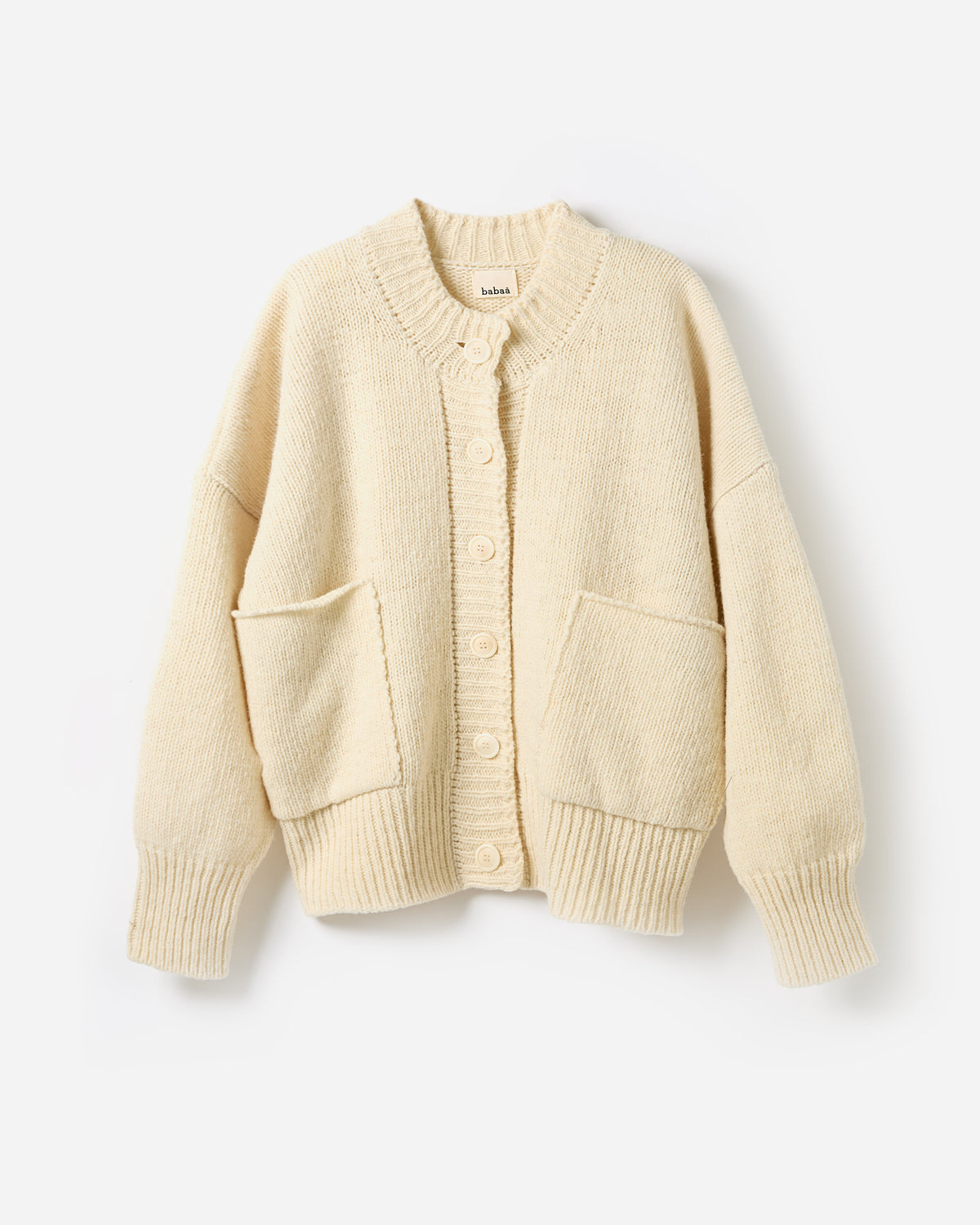 Babaà No11 natural women's cardigan, soft knit fabric, relaxed fit, draped silhouette, neutral color, styled on a model.