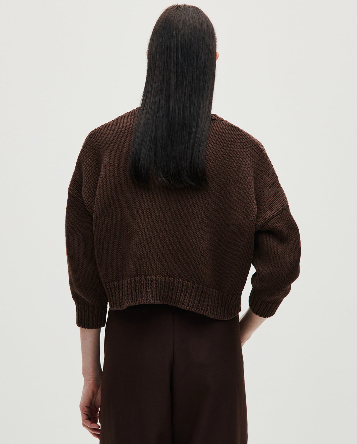 Woman wearing Babaà No14 Husk cardigan, featuring soft knit fabric and a relaxed fit, styled for casual and cozy looks.