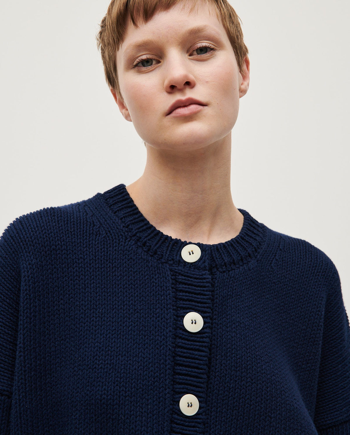 Navy Babaà No14 women's cardigan with long sleeves and button front, soft knit fabric, and ribbed cuffs and hem.