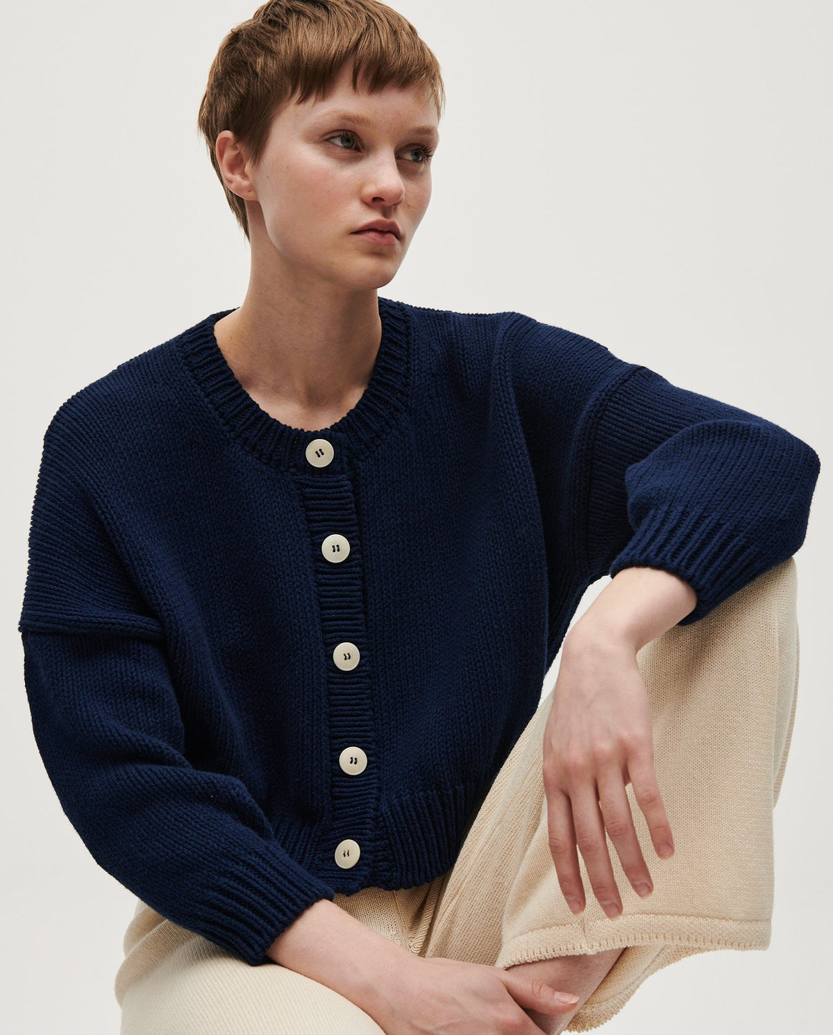 Navy Babaà Cardigan No14 for women, featuring a soft knit fabric and classic design, displayed on a model.