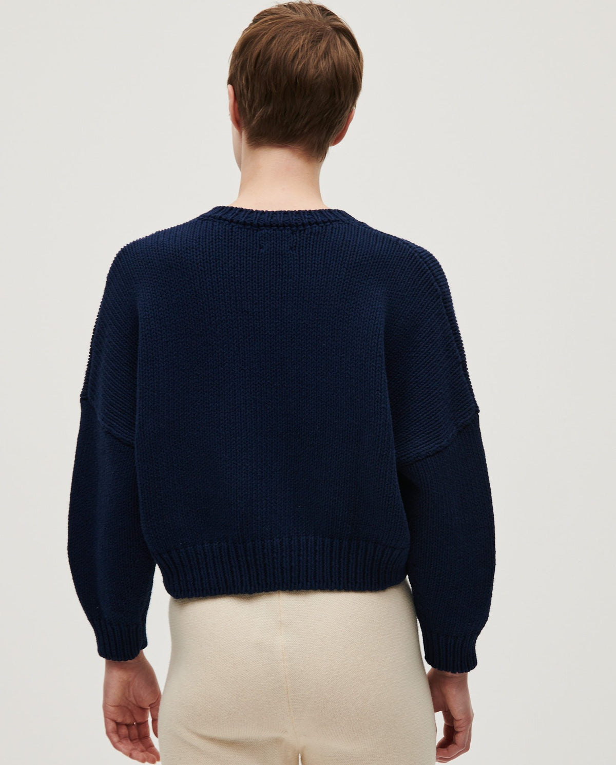 Navy Babaà No14 women's cardigan with a soft knit texture, button-front design, and classic fit displayed on a hanger.