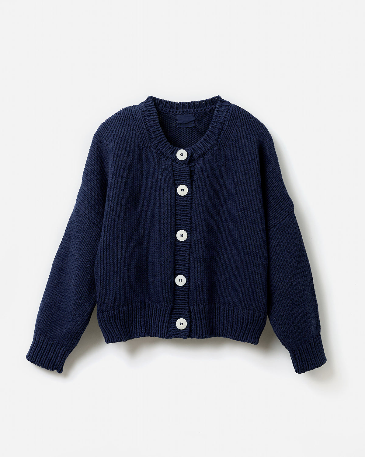 Navy Babaà Cardigan No14 worn by a woman, showcasing a stylish, fitted knit sweater with long sleeves and a V-neck design.