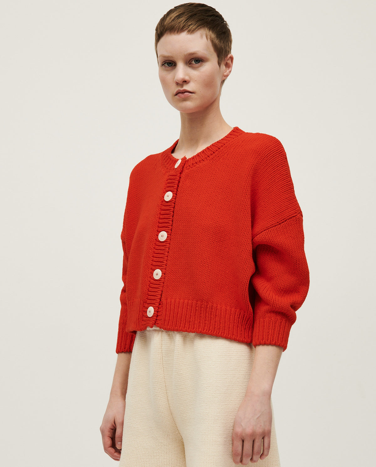 Babaà No14 Summer Flame women's cardigan in vibrant orange, lightweight knit with long sleeves and button closure.
