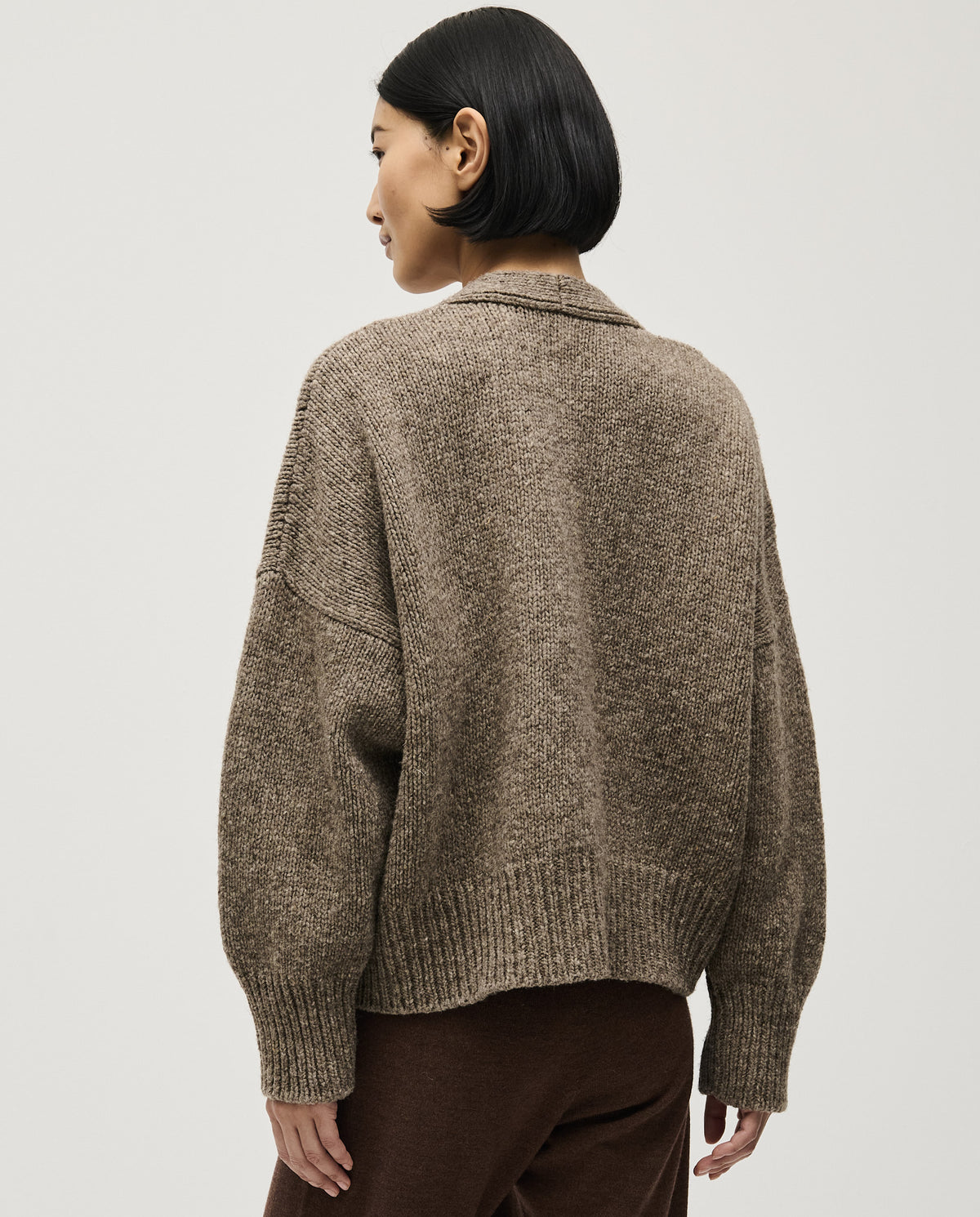 Babaà No17 dark mist women's cardigan displayed on a hanger, showcasing its soft knit fabric and relaxed fit.