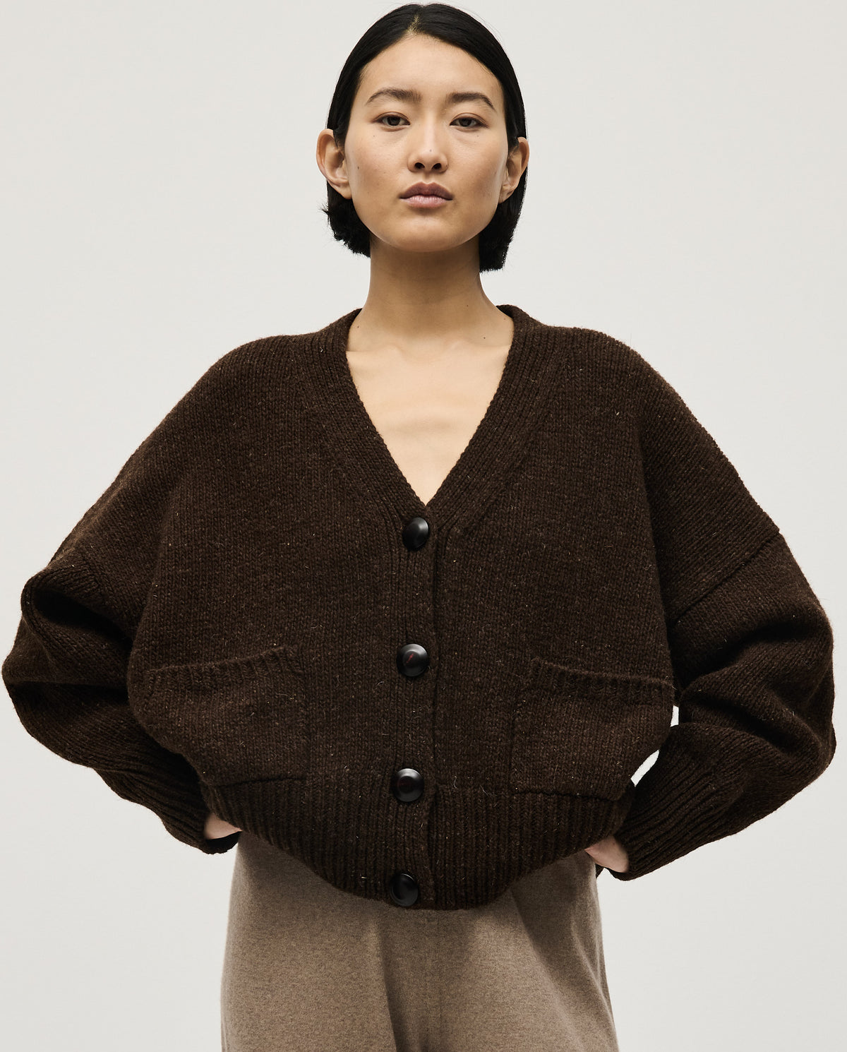 Babaà No17 Earth women's cardigan featuring a cozy knit design in earthy tones, styled with long sleeves and a front button closure.