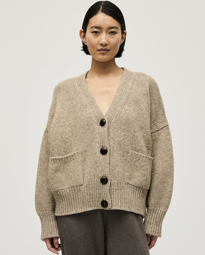 Light gray Babaà No17 Mist cardigan worn by a woman, featuring a soft knit fabric and relaxed fit.