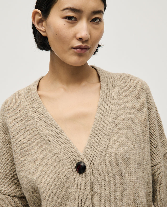 Babaà No17 Mist women's cardigan displayed on a hanger with a soft, lightweight knit fabric and a relaxed fit.