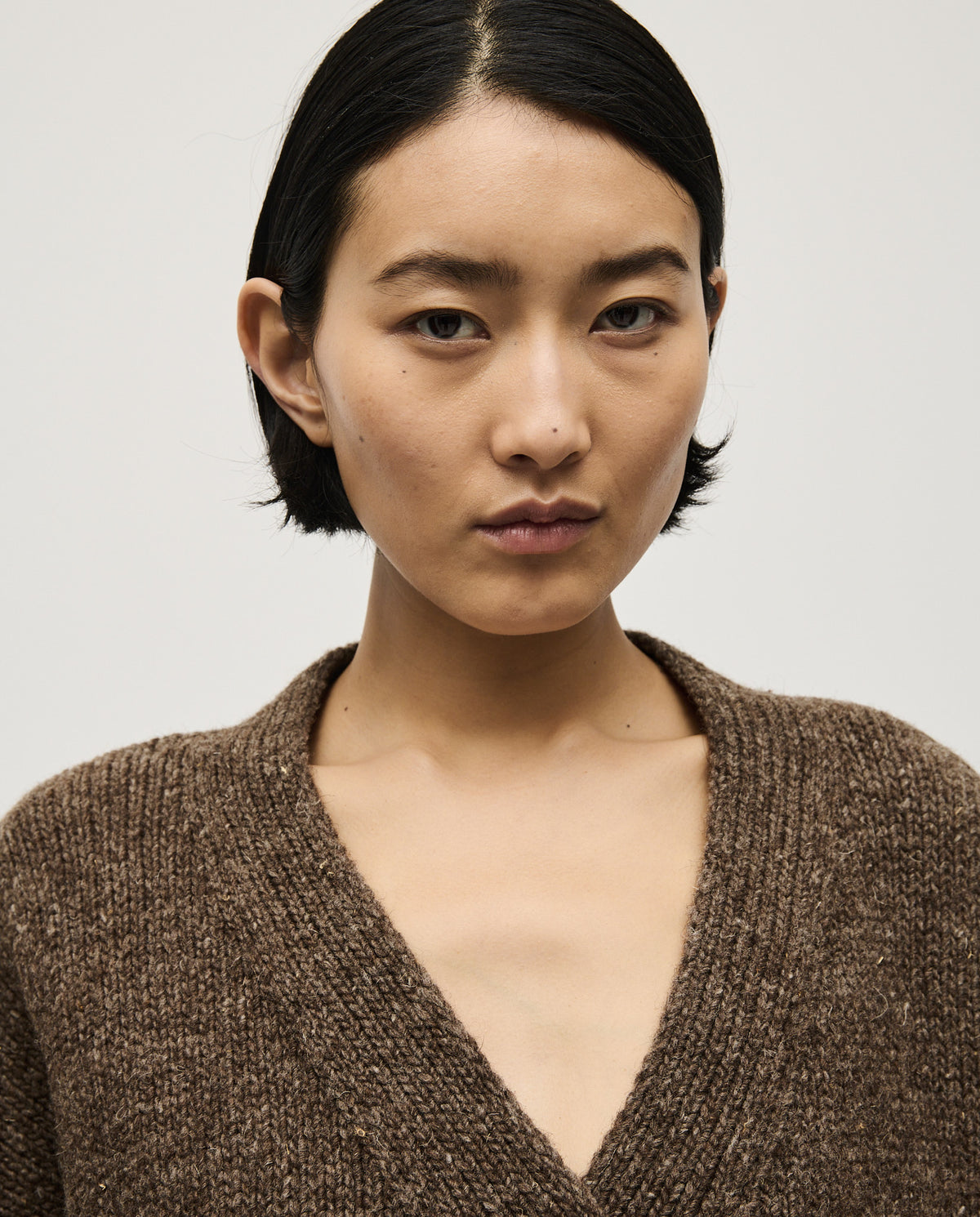 Babaà No17 Oak women's cardigan featuring a cozy knit design in warm oak brown, with long sleeves and button closure.