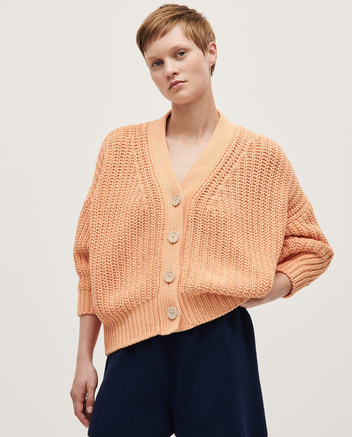 Babaà No18 Cantaloupe women's cardigan featuring soft knit fabric and a relaxed fit, displayed on a model.