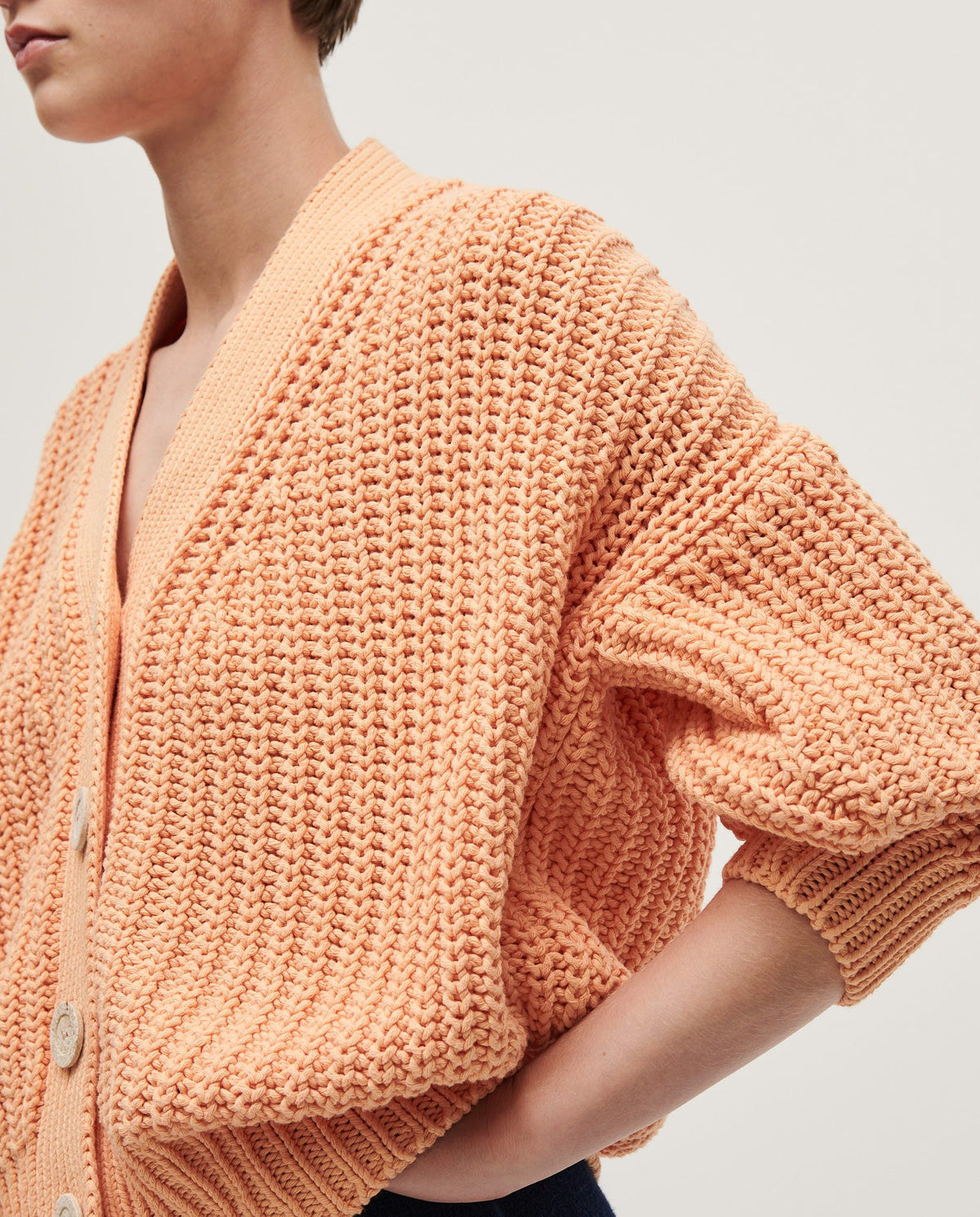 Babaà No18 Cantaloupe women's cardigan in soft knit, featuring a relaxed fit and button-front design.