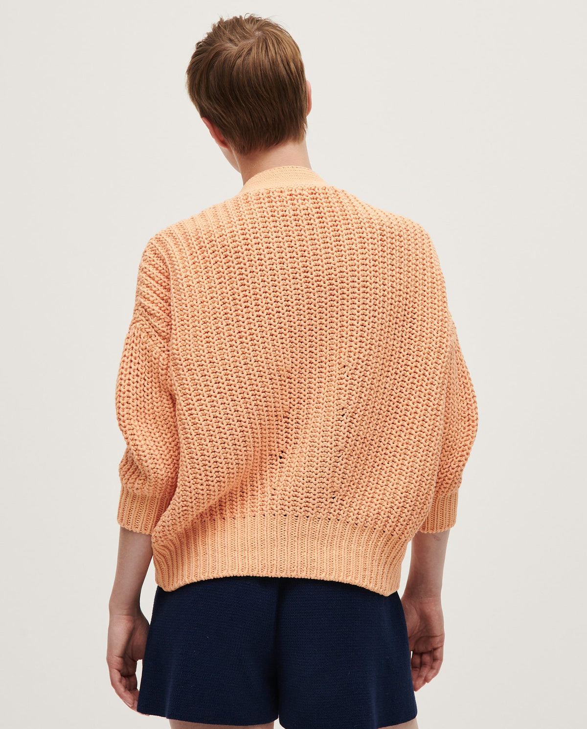 Babaà No18 Cantaloupe women's cardigan in soft knit fabric, featuring a relaxed fit and button-up front.