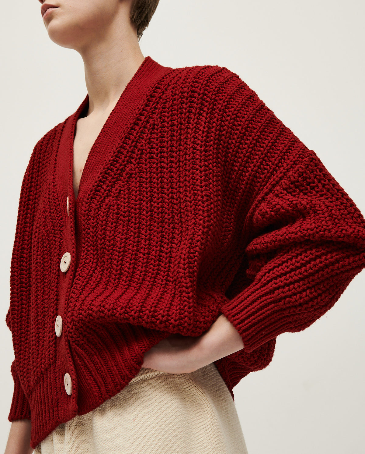 Babaà No18 Persephone women's cardigan in soft knit, featuring a relaxed fit and button closure, shown in a neutral color.