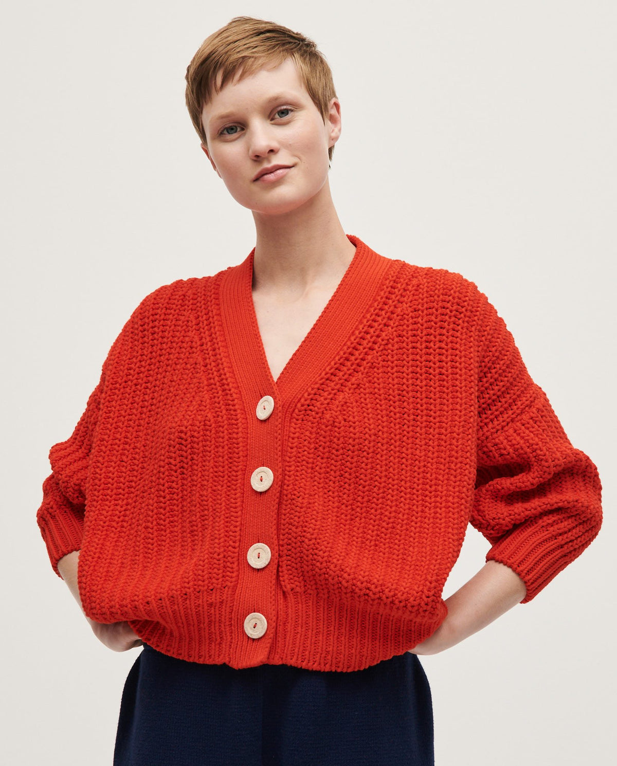 Babaà No18 Summer Flame cardigan for women, featuring a lightweight knit in vibrant flame colors, styled for casual wear.