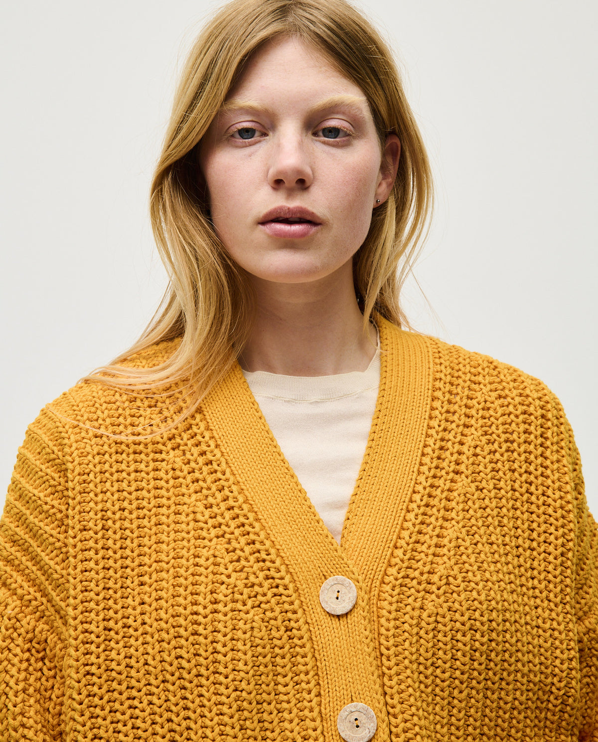 Babaà No18 Yolk women's cardigan featuring a cozy knit design, with a relaxed fit and vibrant yellow color.