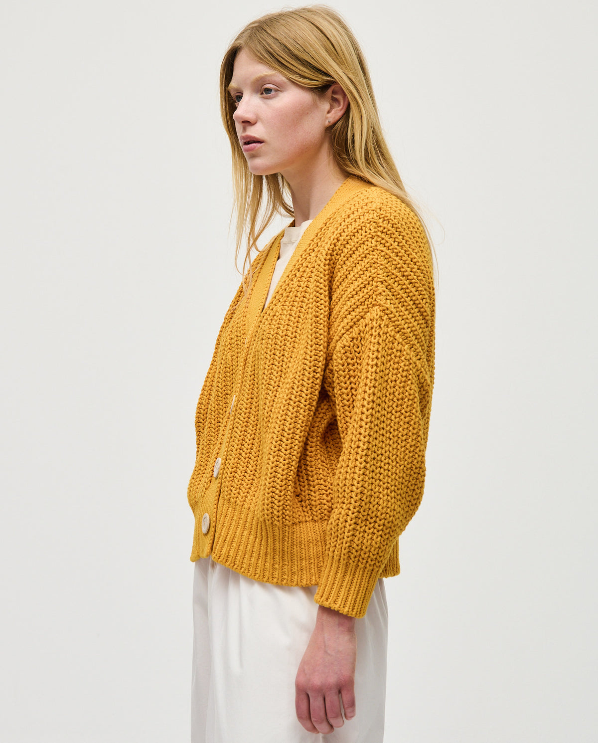 Babaà No18 Yolk women's cardigan featuring a cozy knit design and button closure, in a warm yolk color.