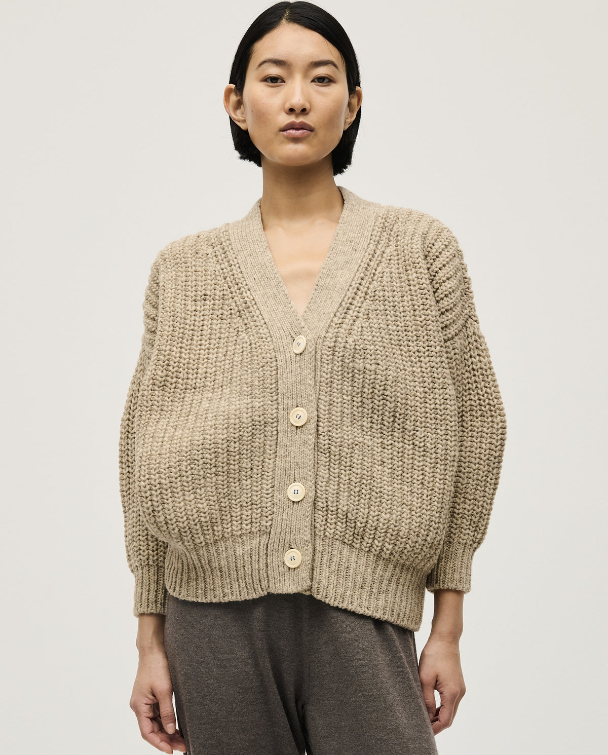 Light gray Babaà No19 Mist cardigan worn by a woman, featuring a soft knit fabric and relaxed fit for casual style.
