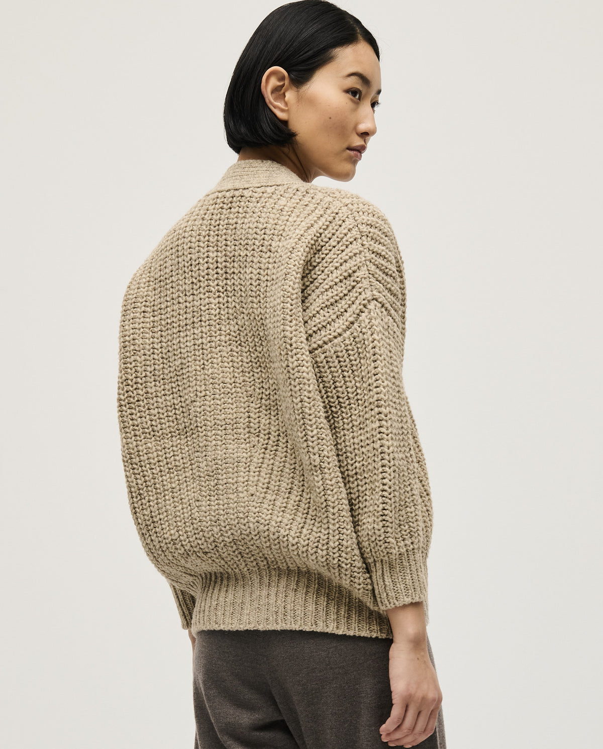 Light gray Babaà No19 Mist cardigan for women, soft knit with a relaxed fit, shown on a model.