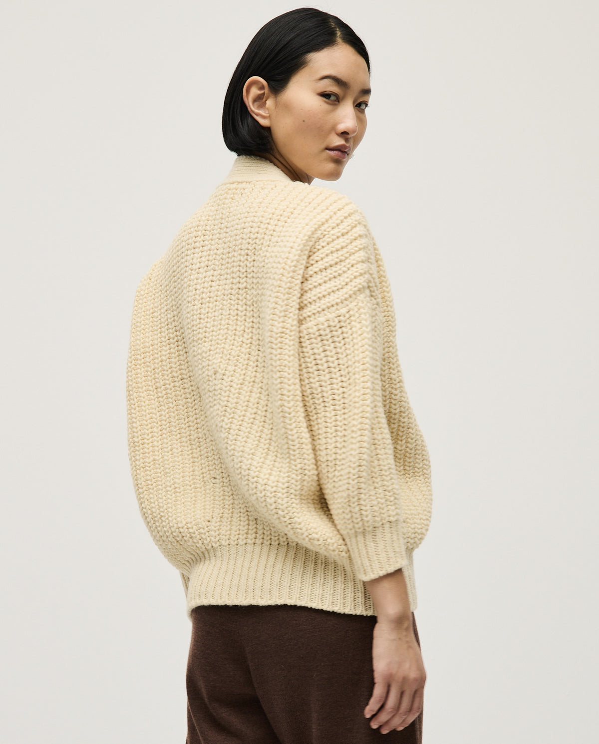 Babaà No19 natural women's cardigan, soft knit with long sleeves and open front, displayed on a model against a neutral background.