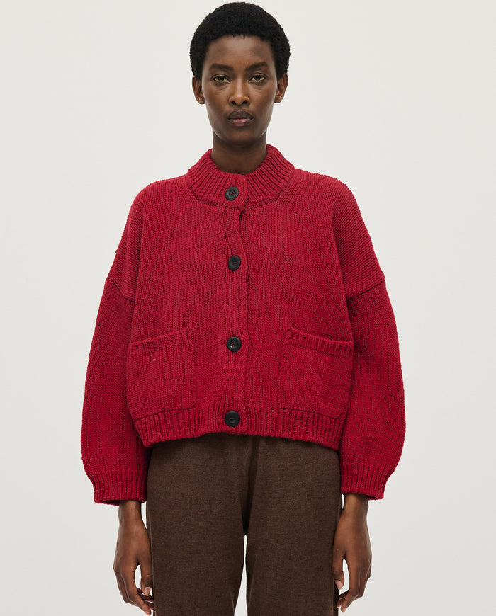 Babaà No23 Cereza women's cardigan in vibrant red, soft knit with button closure, styled with sleeves and collar detail.