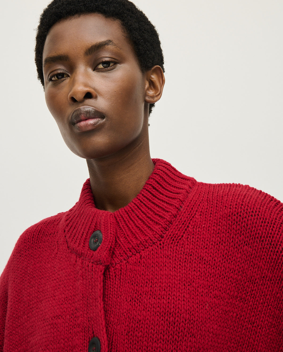 Babaà No23 Cereza women's cardigan in vibrant red, featuring a cozy knit texture and button-front design.