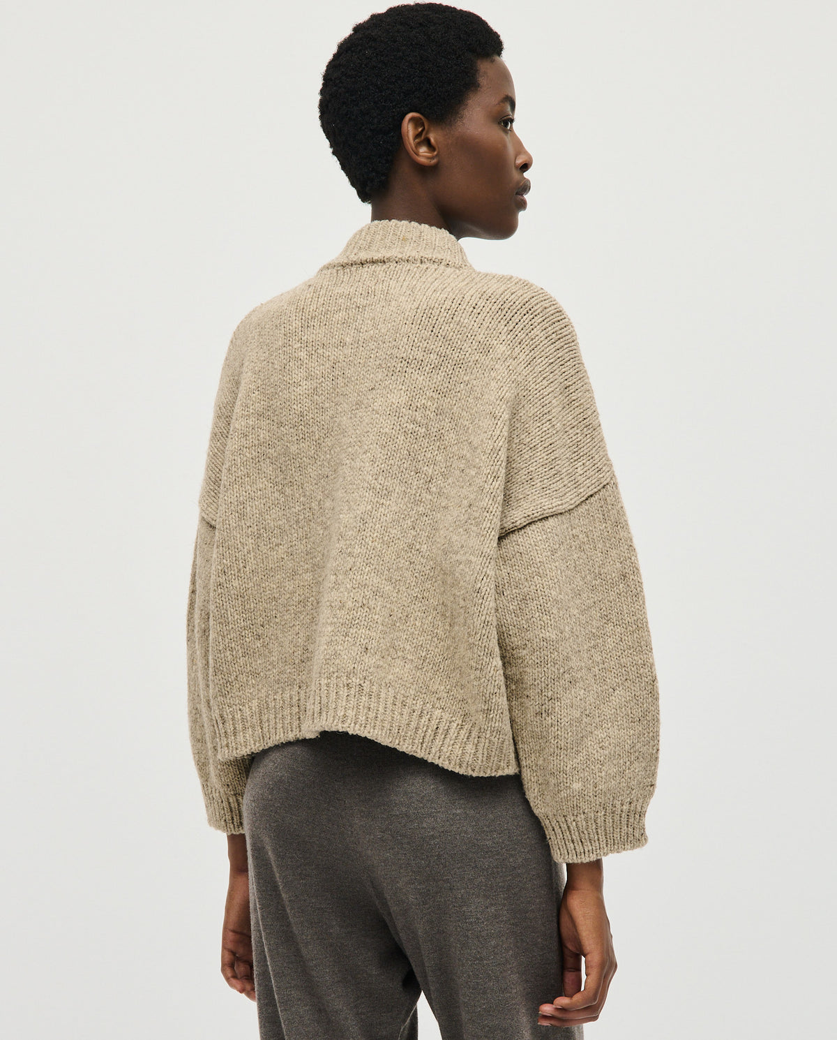 Light gray Babaà No23 Mist cardigan worn by a woman, showing a soft knit texture and relaxed fit.