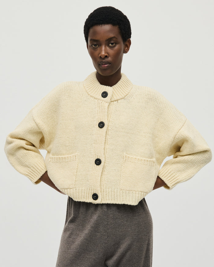 Babaà No23 natural women's cardigan, soft knit fabric, long sleeves, button-up front, and classic V-neck design.