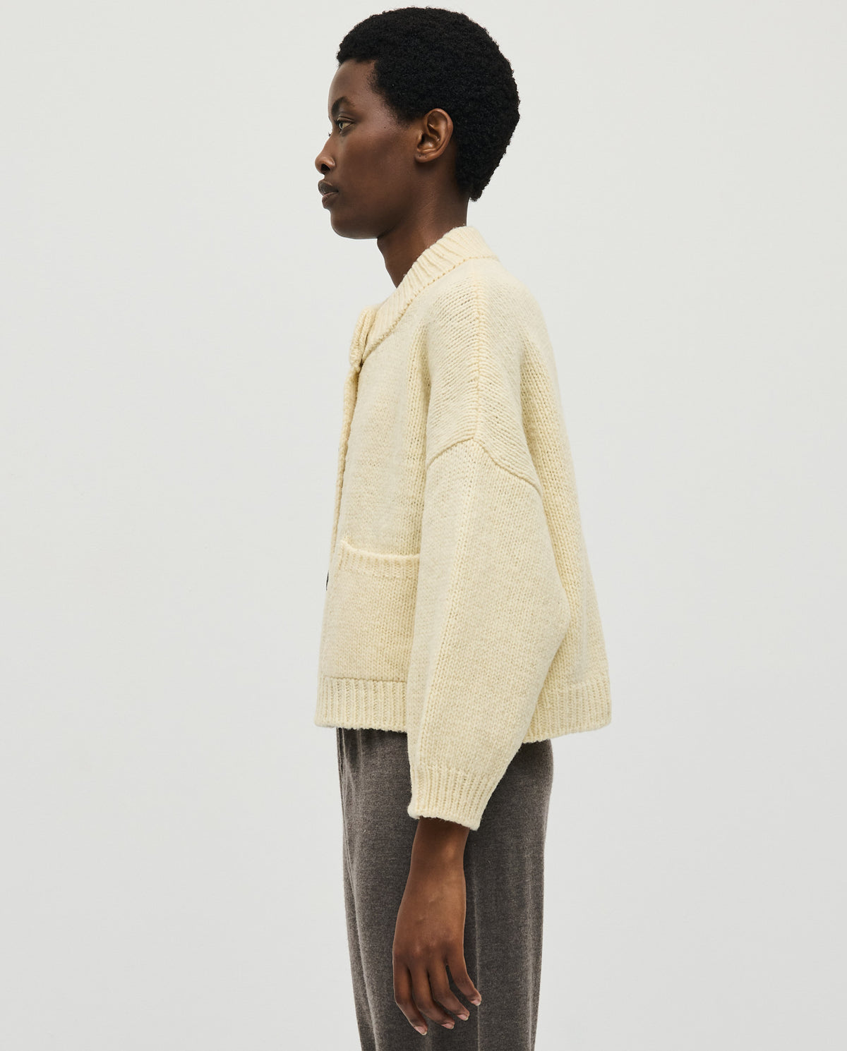 Babaà no23 natural women's cardigan displaying a soft beige knit with a relaxed fit and button closure.