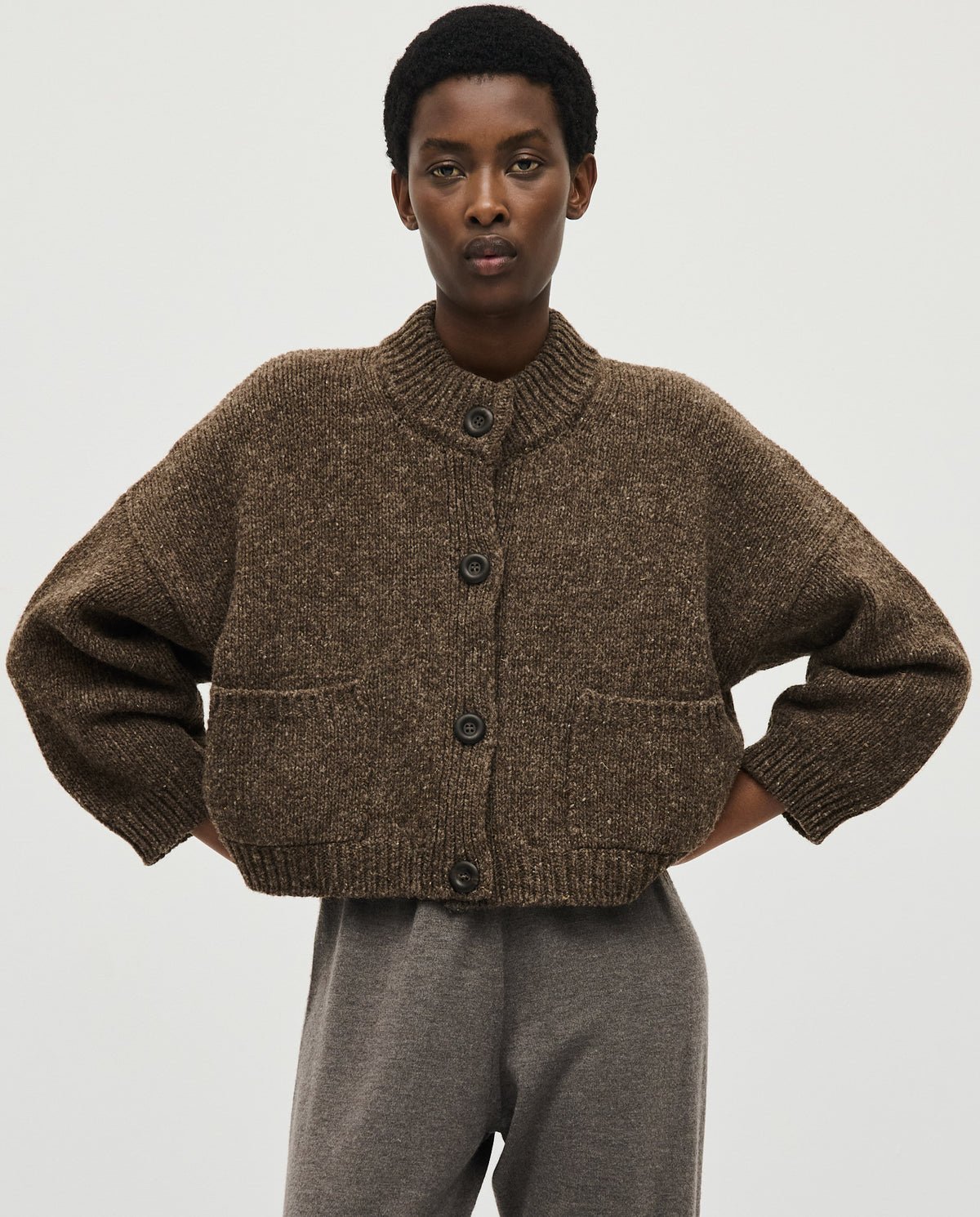 Babaà No23 Oak women's cardigan featuring a cozy, knitted design in warm oak color, with button details and a relaxed fit.