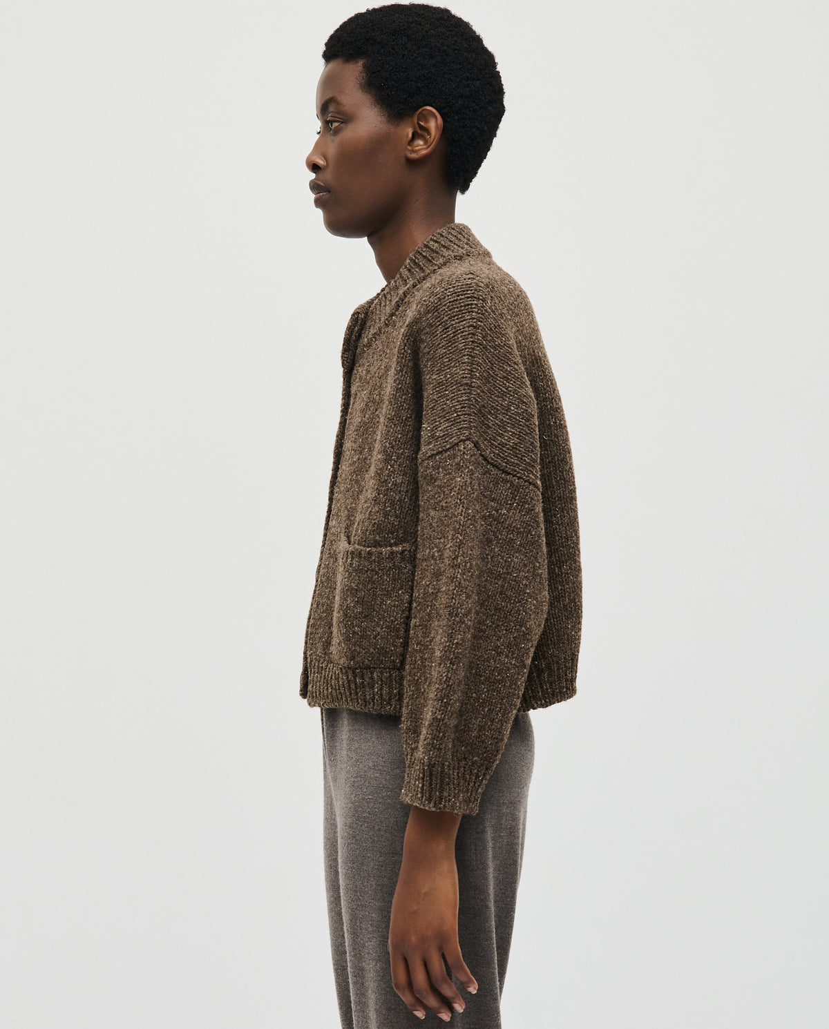 Babaà No23 Oak women's cardigan in soft knit, featuring a relaxed fit and button closure, displayed on a hanger.