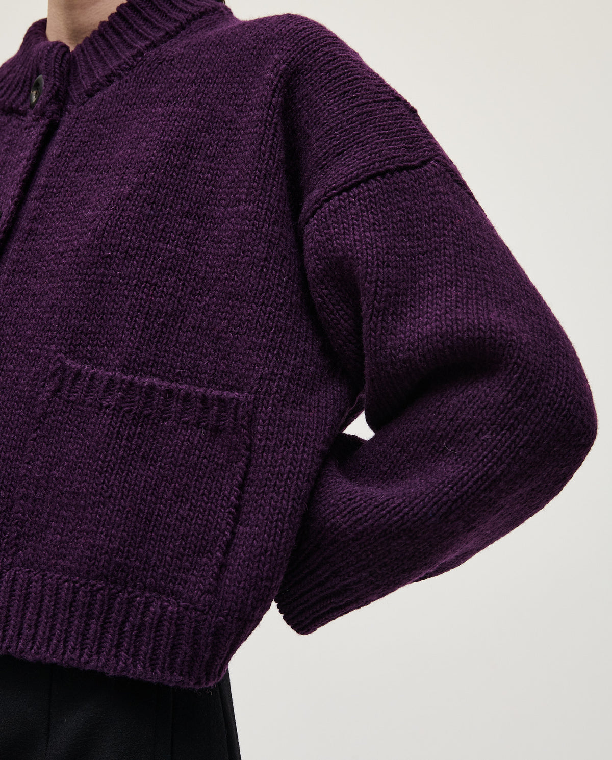 Purple Babaà No23 women's cardigan displayed on a hanger, showcasing its soft knit fabric and classic design.