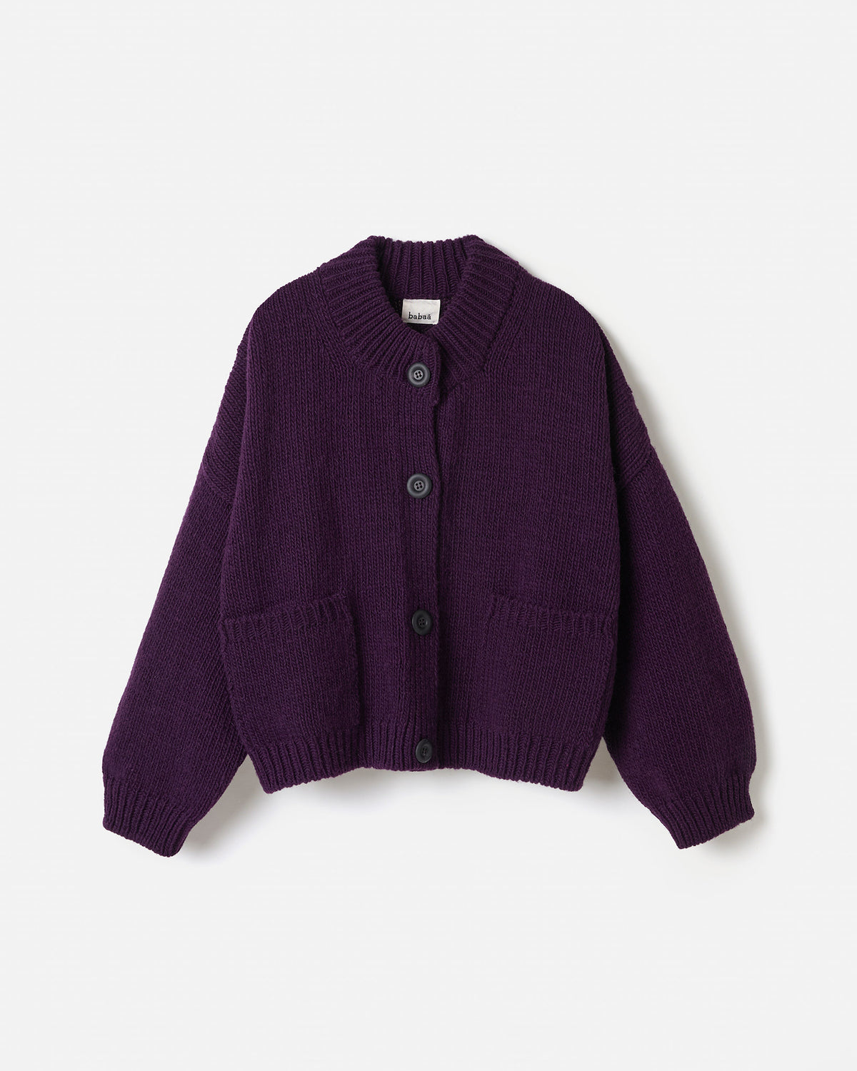 Woman wearing Babaà No23 purple cardigan, showcasing its silhouette and soft fabric in a stylish, relaxed fit.