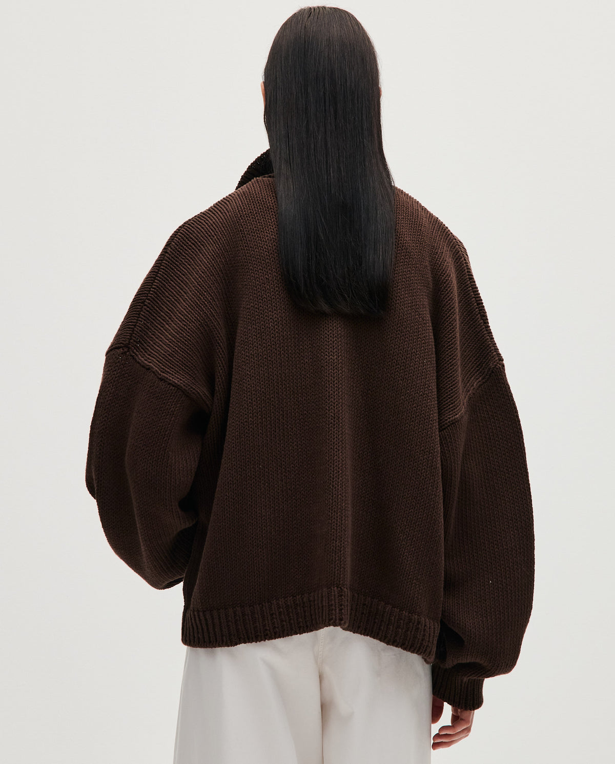 Babaà No44 Husk women's cardigan displayed draped on a model, featuring soft knit fabric and a relaxed fit.