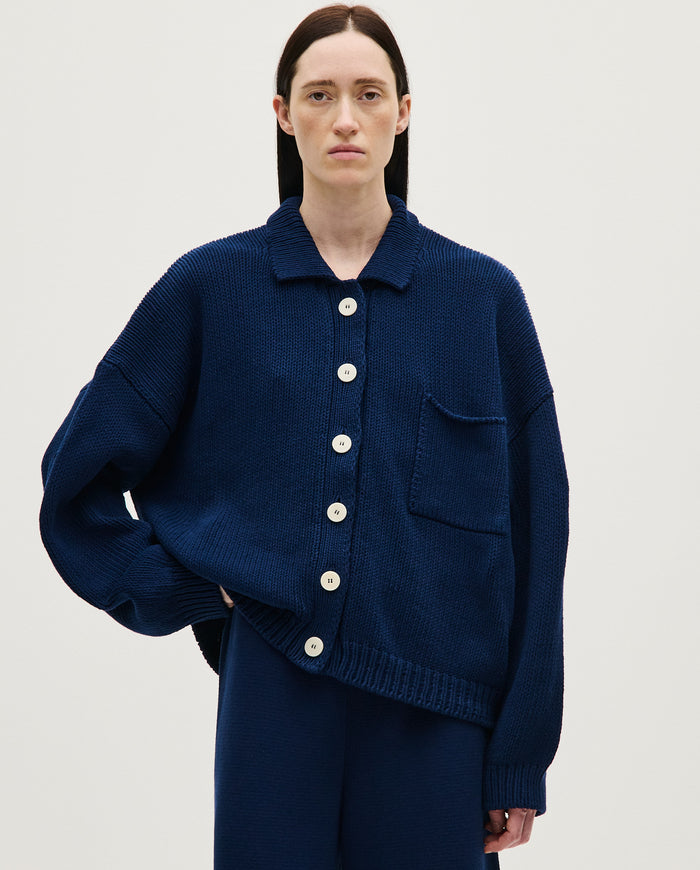 Navy women's cardigan No44 by Babaà, featuring a soft knit fabric and button-front design, displayed on a hanger.