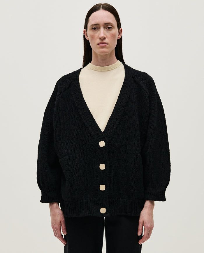 Black Babaà No51 women's cardigan with a relaxed fit and button closure, shown on a model in a casual setting.