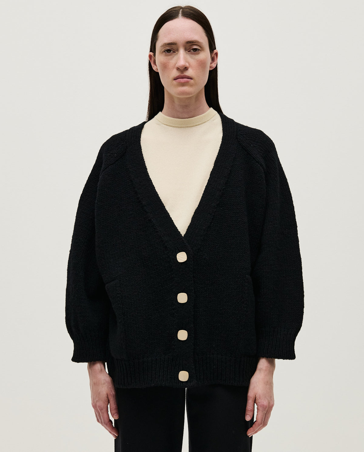 Black Babaà No51 women's cardigan with a relaxed fit and button closure, shown on a model in a casual setting.