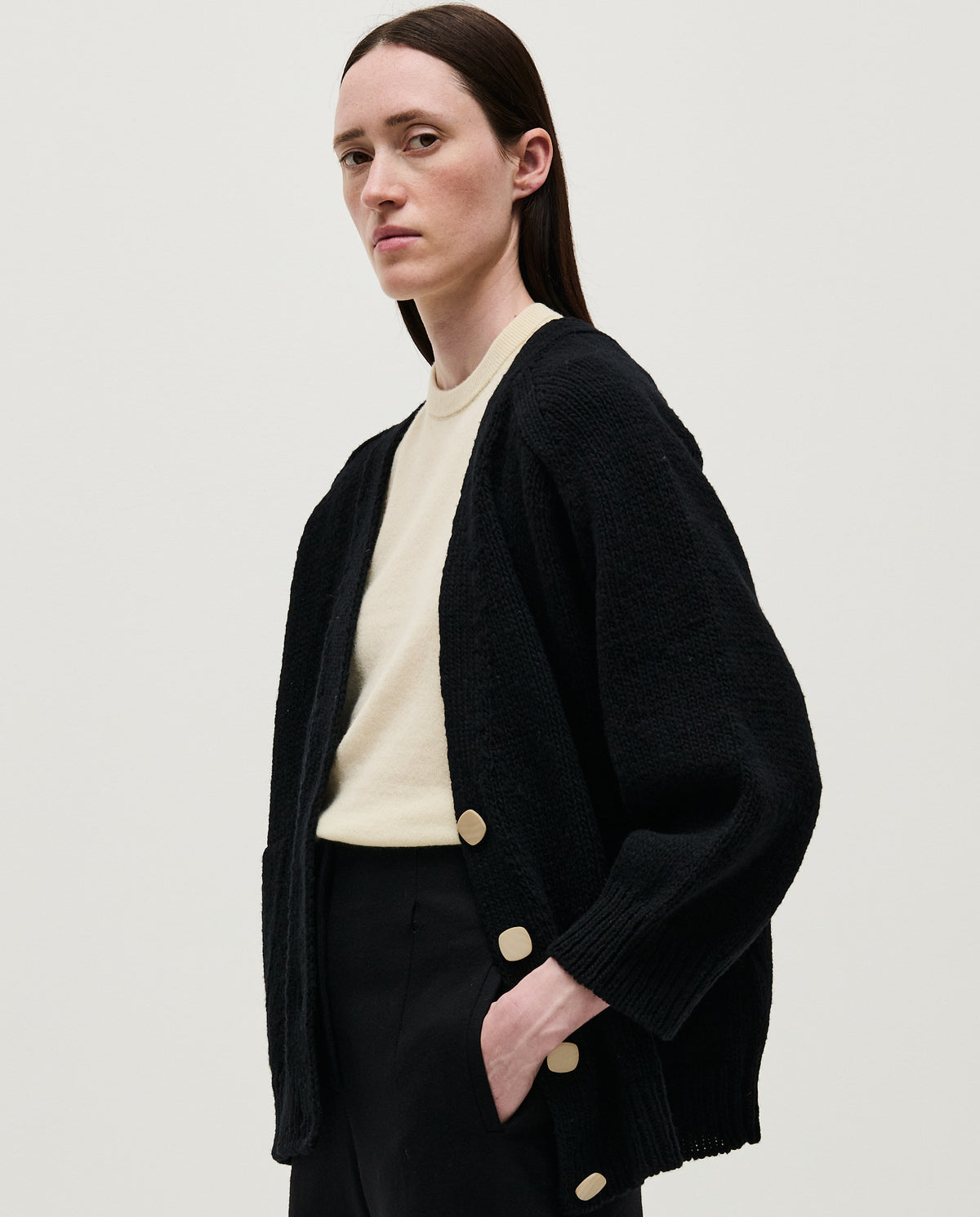Black Babaà No51 women's cardigan displayed on a woman, showcasing a cozy, stylish knit sweater with button details.